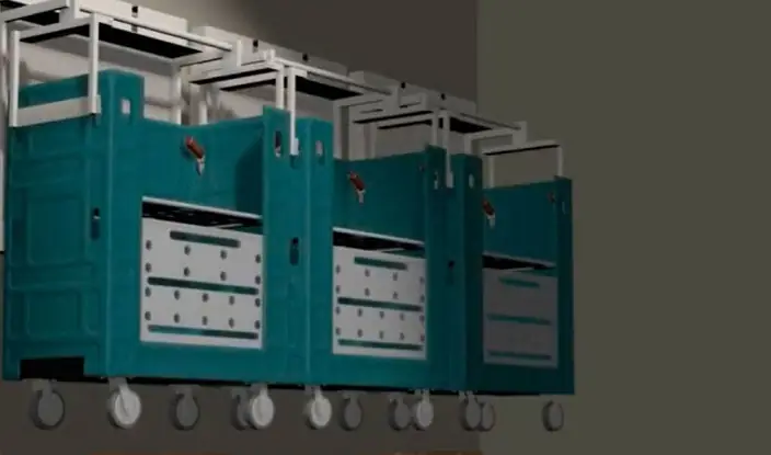 Row of wheeled laundry and linen carts hung on wall-mounted lift brackets to keep the floor clear
