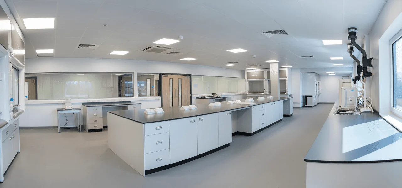Modern laboratory with white counters and cabinets