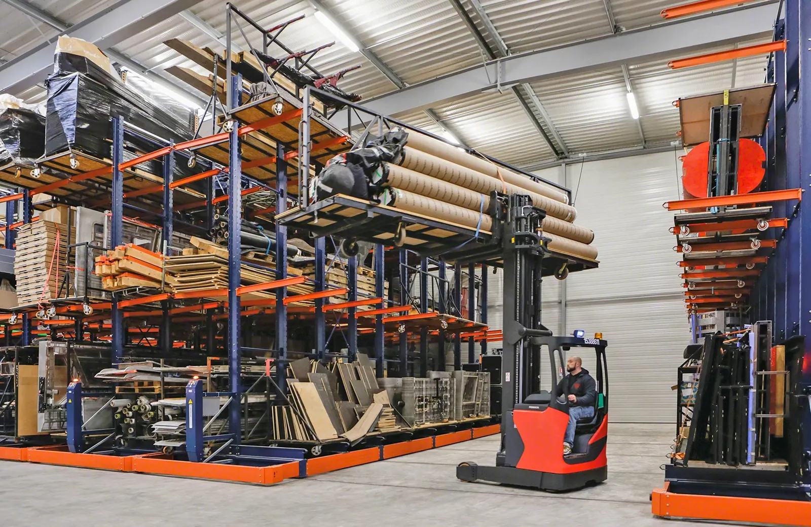 Interlake Mecalux mobile racking on floor rails with a reach truck working the open aisle