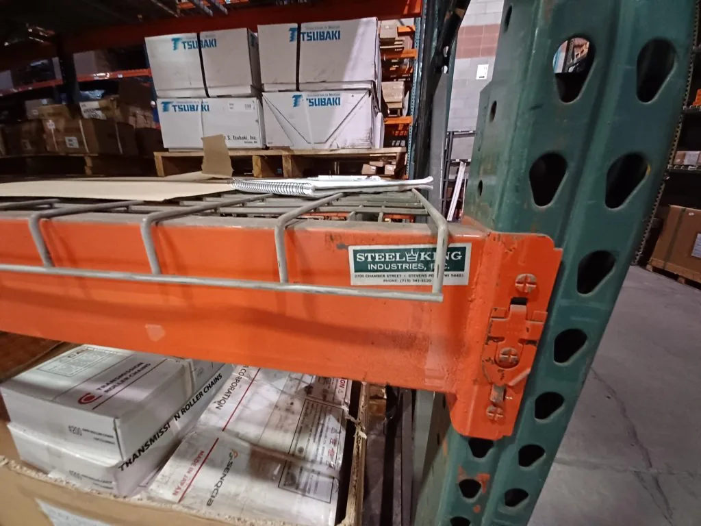 Steel King beam connected to an aging upright in the existing Motion Industries rack