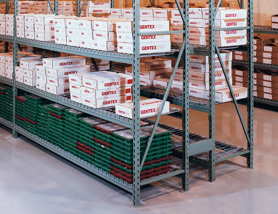 Penco Wide Span shelving with gray welded frames holding white cartons on upper levels and green bins on a wire deck