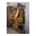 New-Tech wall mounted chrome Ready Rack holding turnout gear in a station hallway