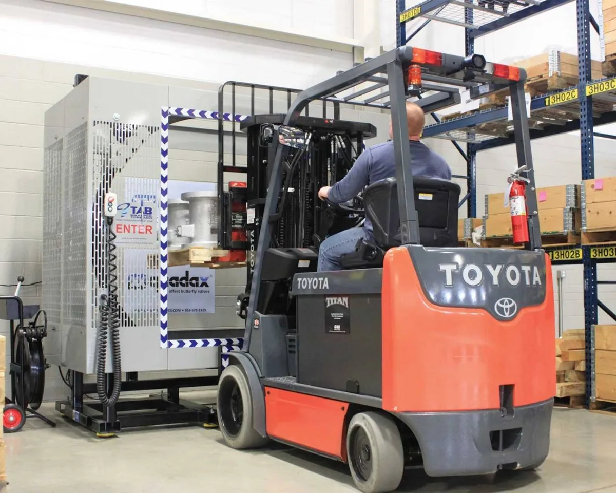 Forklift driver feeding a pallet into a TAB Wrapper Tornado orbital stretch wrapper